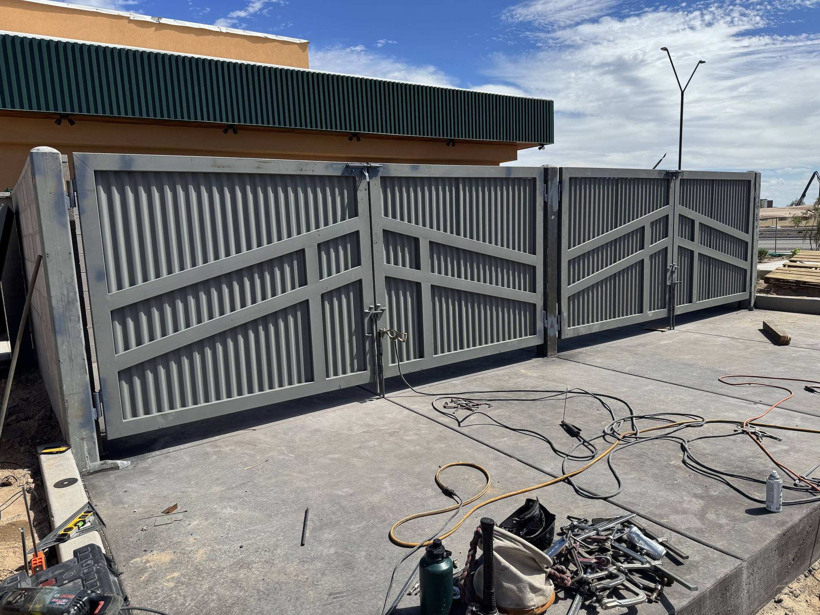 Corrugated metal gate assembly